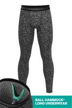 Load image into Gallery viewer, A person in Ball Hammock® long johns with a composition notebook.