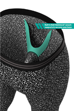 Load image into Gallery viewer, A close-up of a composition notebook and Ball Hammock® long johns.