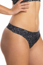 Load image into Gallery viewer, A close-up of a woman wearing The Big Bang | Constellation Seamless Thong.