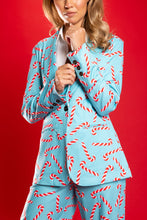 Load image into Gallery viewer, A woman in a candy cane blazer, close-up of hand and nose.