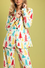 Load image into Gallery viewer, A woman in a unique suit with retro Christmas tree patterns, a floral shirt, and sunglasses.