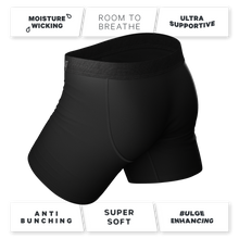 Load image into Gallery viewer, A close-up of The 009 | Black Tuxedo Ball Hammock® Pouch Underwear With Fly logo.