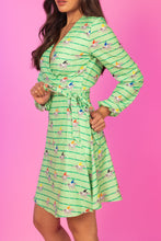 Load image into Gallery viewer, A woman in a Derby Horse Racing Stripe Wrap Dress.