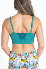 Load image into Gallery viewer, A woman in a green paradICE‚Ñ¢ Cooling Bralette.