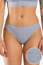 Load image into Gallery viewer, Close-up of cooling thong on woman&#39;s body, showing fabric and skin details.
