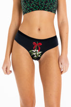 Load image into Gallery viewer, A woman in The Kiss Me There | Mistletoe Cheeky Underwear.
