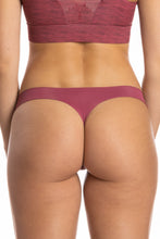 Load image into Gallery viewer, A close-up of seamless thong underwear on a woman.
