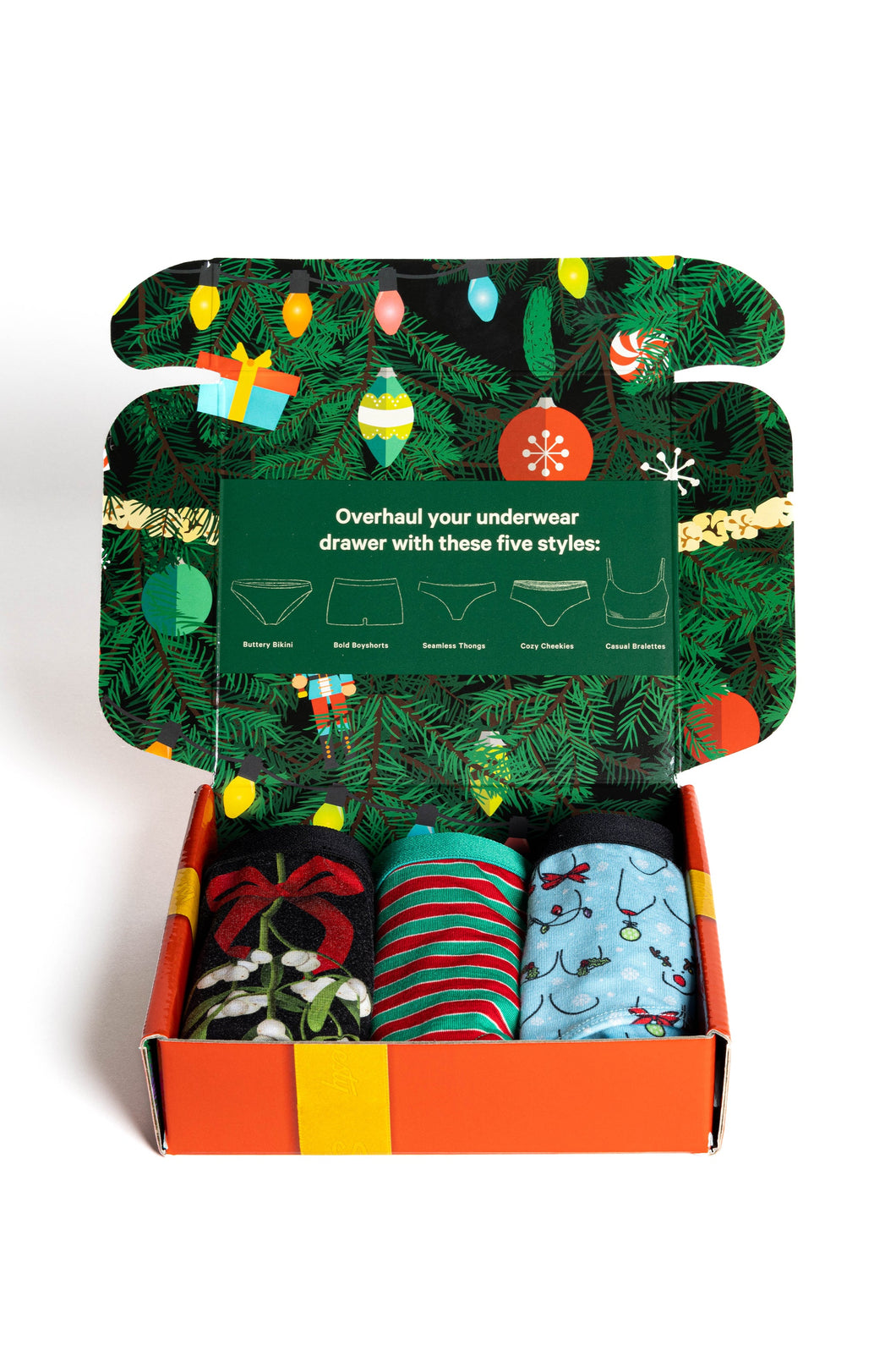 A box of socks and underwear with festive decorations.