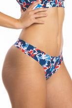 Load image into Gallery viewer, A woman wearing The Grand Finale USA Camouflage Seamless Thong.
