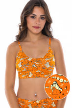 Load image into Gallery viewer, A woman in The Paranormal Entitty bralette, with a ghost design, close-ups of chest and leg.
