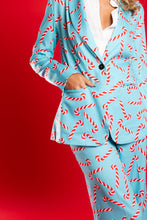 Load image into Gallery viewer, A person in The Peppermint Pimp Canes suit with candy canes, attracting attention and hunger with a unique fashion statement.
