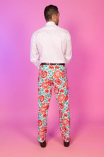 Load image into Gallery viewer, A man in floral pants, part of The Win By A Rose collection, exudes spring vibes. Perfect for a derby party or summer picnic.
