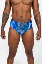 Load image into Gallery viewer, A man in a wolf face swim brief, embodying the Truck Stop Classic vibe.
